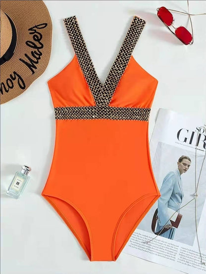 Stella® | V-neck swimsuit with gold details