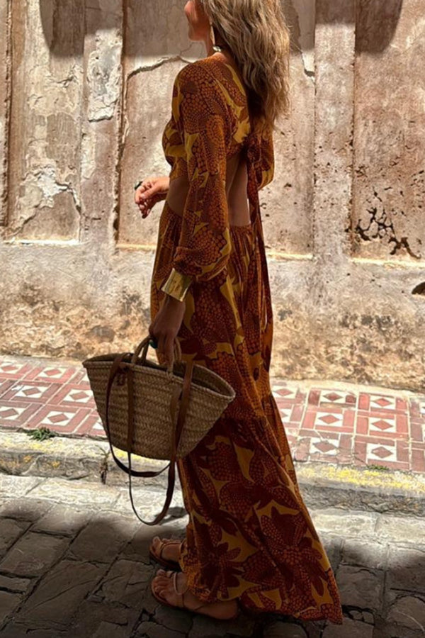 Vivian® | Long sleeve maxi dress with a sunflower print and a ring neckline at the waist