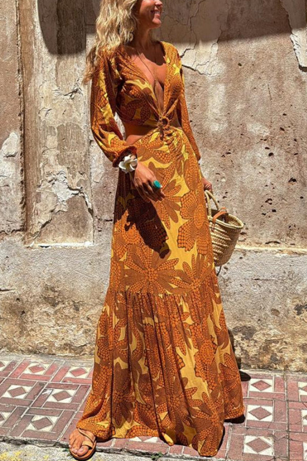 Vivian® | Long sleeve maxi dress with a sunflower print and a ring neckline at the waist