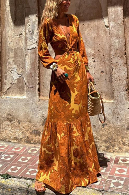 Vivian® | Long sleeve maxi dress with a sunflower print and a ring neckline at the waist