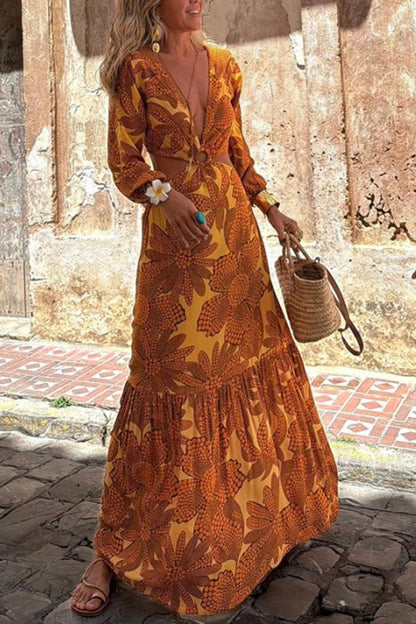 Vivian® | Long sleeve maxi dress with a sunflower print and a ring neckline at the waist