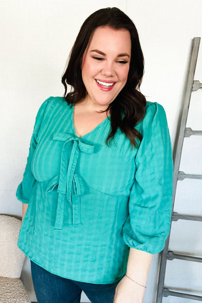 Tilly® | Mint woven babydoll blouse with bow and V-neck