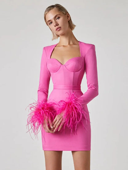 Amara® | Long sleeve mini bandage dress with feathers in pink and black