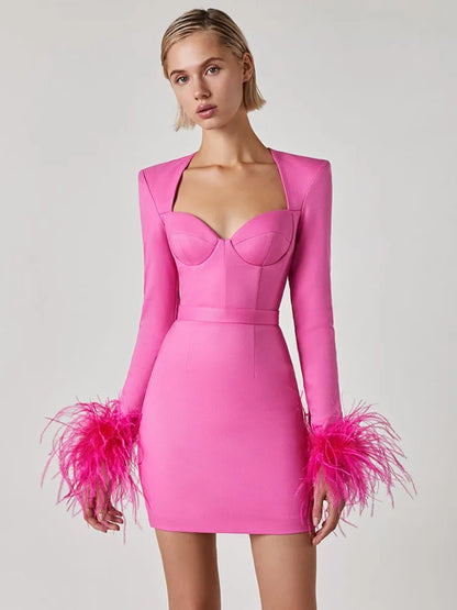 Amara® | Long sleeve mini bandage dress with feathers in pink and black