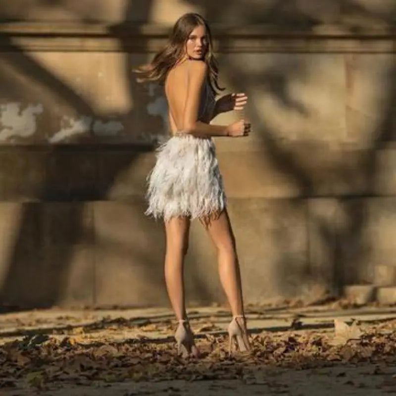 Tania® | Figure-hugging mini dress with sequins and feathers