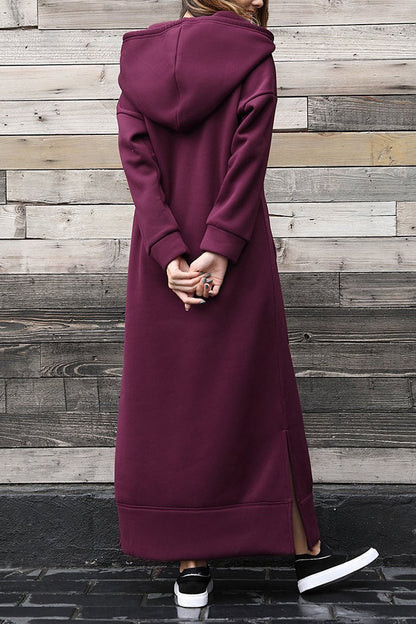 Nadia® | Solid hooded dress with pockets and a slit at the hem