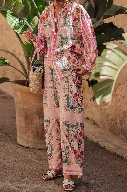 Yvonne® | Set consisting of a loose blouse with a floral charm and a unique print and trousers with an elastic waistband and pockets